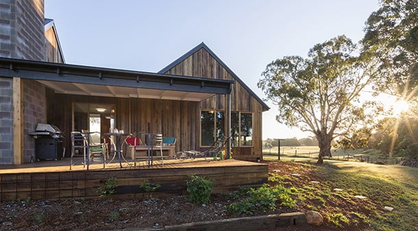 A large grey ironbark deck tucked in the angle between pavilions provides a peaceful shady spot to lounge, without blocking winter sun to any of the living spaces. The house is clad with rough-sawn spotted gum, which will fade to grey as it weathers.