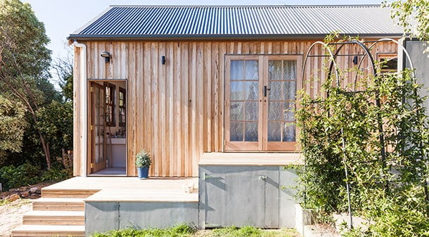 The modest floor area of the shack is complemented by a big deck and under-deck storage. For the cladding, raw fibre-cement sheet and radially sawn silvertop ash were chosen. The timber was left raw to minimise maintenance, and will weather to grey.
