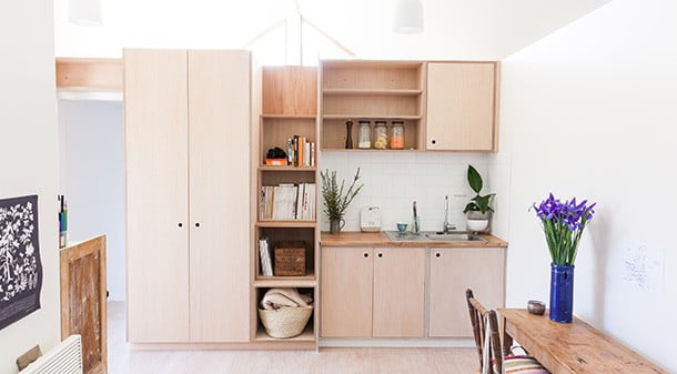 The kitchenette joinery is plywood sealed with a low-VOC Cutek finish. Look closely and you’ll see a stairway to the loft cleverly integrated into the kitchen shelving. 