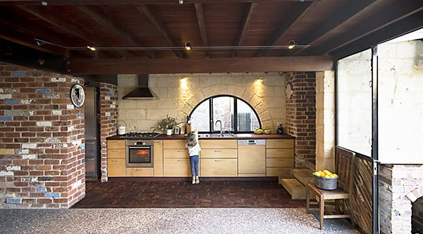In a break from hard surfaces, recycled timber in a parquetry pattern is used in the kitchen. 