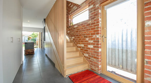 The eastern wall of the extension is of reverse recycled-brick veneer, providing thermal mass benefits and an attractive texture. And a second external door with ramp entry to the new part of the house means that no more prams will need to be left on the front porch.