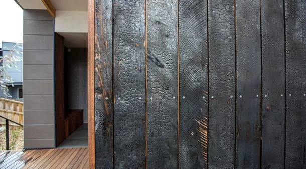 The 'Shou sugi-ban' burnt cypress shiplap cladding is made using local Macrocarpa, a species typically used as a windbreak on Tasmanian farms. The finish is low maintenance and strikingly beautiful.