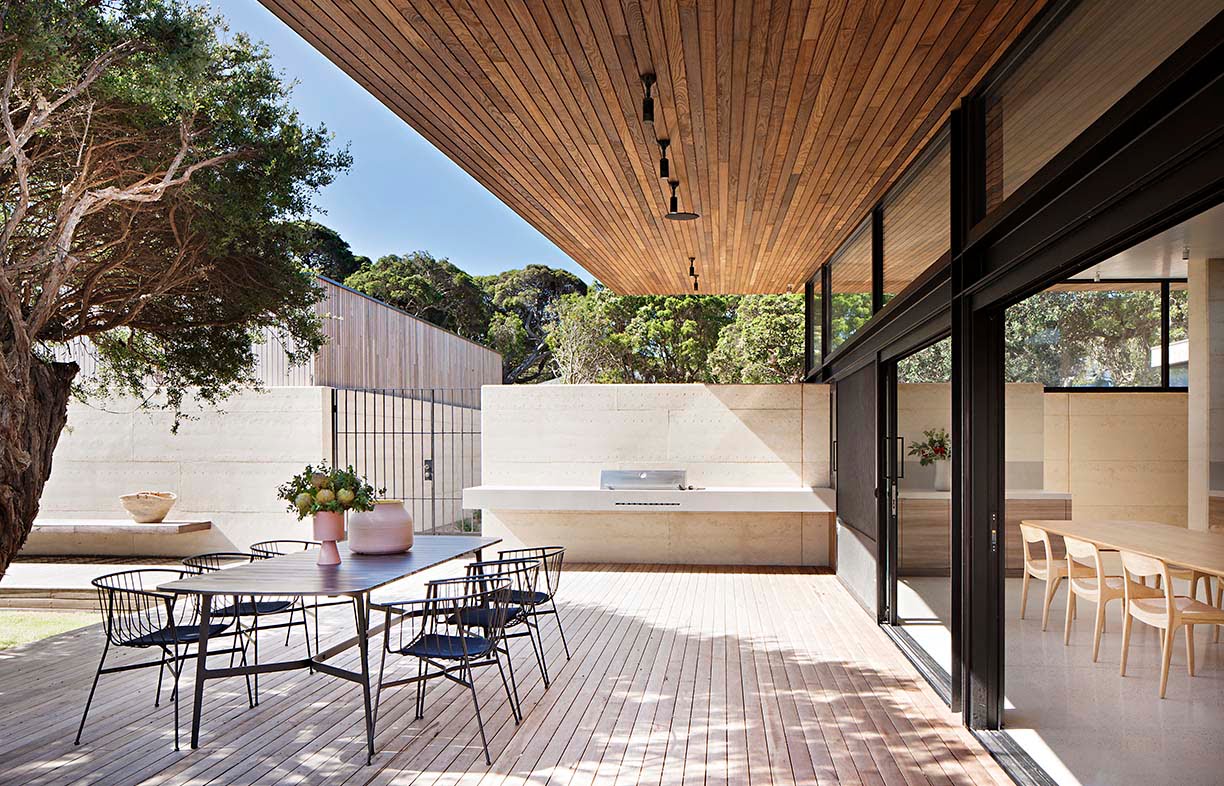 The Layer House by Robson Rak Architects is a great example of how natural materials, such as rammed earth, can be combined with shade plants to create a multi-seasonal living space. Image: Shannon McGrath 